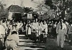 Rev. T.H.Huang leads the funeral procession at the Western Road Cemetery.