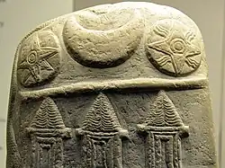 The solar symbol of Shamash (right) on a kudurru, with the star of Ishtar on the left and a crescent of Sin.