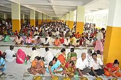 Devotees having Prasad in Anandabazar