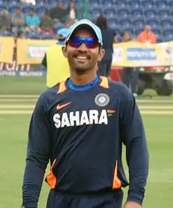 Karthik, smiling, in sunglasses