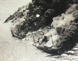 Dixie Arrow breaking in two, with fire engulfing both parts; viewed from a slightly different angle