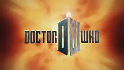 In front of a fiery background, steely gray block letters spell out "DOCTOR WHO". In between the two words is a large D and W which are angeled together to form a box; atop of the structure is a bright lamp light.