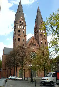 A red brick building, with two towers