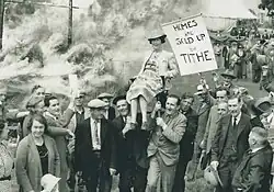 Held aloft by supporters at Wortham Manor in 1939 after the bankruptcy sale
