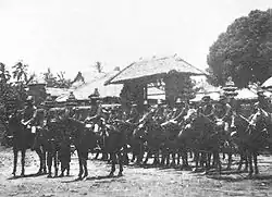 Dutch cavalry in front of the Royal Palace at Tabanan during the Dutch intervention in Bali (1906)