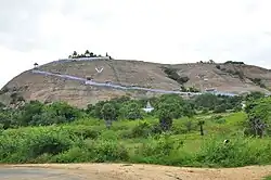A distant view of a temple atop a hill