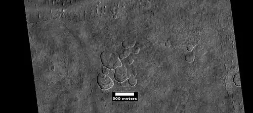 Scalloped ground, as seen by HiRISE under HiWish program.