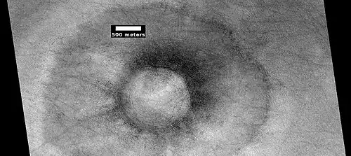 Pedestal crater with boulders along rim. Such craters are called "halo craters."[116] Picture taken with HiRISE under HiWish program.