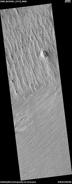Wide view of yardangs, as seen by HiRISE under HiWish program. This image is odd in that the yardangs are lined up in different directions in the top and bottom part of image. The wind direction probably changed to cause this.