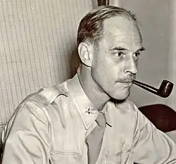 Black and white 1941 head and shoulders photo of brigadier General Edward J. Stackpole in duty uniform and necktie, with smoking pipe at left corner of mouth