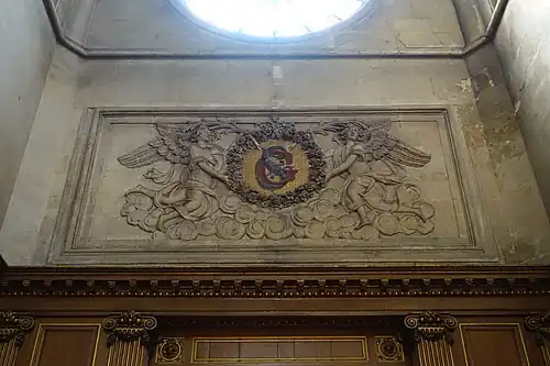 Stone carving below rose window in the transept