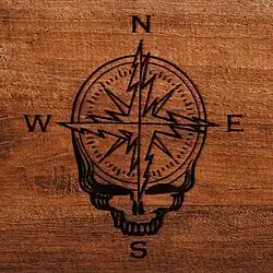 A lightning bolt skull logo with an incorporated compass