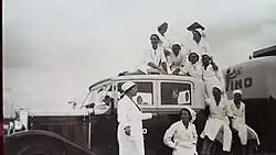 Staff stand in front of a Fino truck
