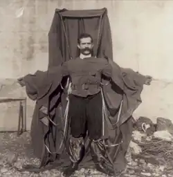 A man wearing a frame draped in material
