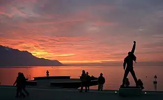 Freddie Mercury statue at sunset in Montreux.