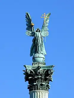 Archangel Gabriel holds the Holy Crown and the apostolic double cross as the symbols of Hungary, Hősök tere, Budapest