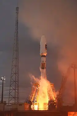 Soyuz launch – a moment of support arms release. Lightning safety tower visible on a left.