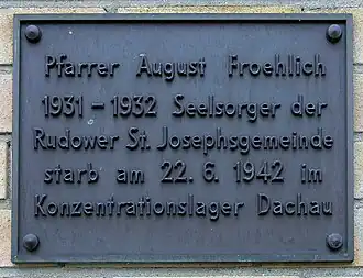 Commemorative plaque in memorial of August Froehlich, in front of St Josef's parish in Berlin-Rudow.
