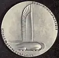 General Motors 25th anniversary medal, 1933, featuring teardrop shaped car