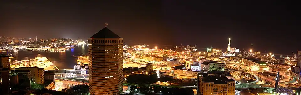 The port of Genoa at night-time, with lights illuminating it