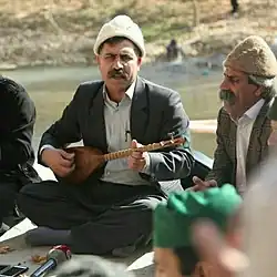 Iranian/Kurdish tanbur. Musician and luthier Ghobad Ghobadi (تنبورقبادی), a face of Yarsanism plays a Kurdish tanbur. Ghobadi makes tanburs in the Yarsan tradition.[52]