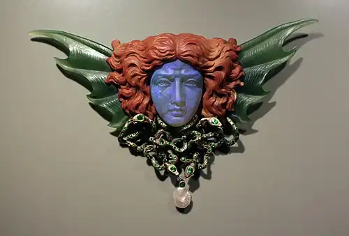 Art Nouveau mascaron-shaped breast ornament, designed by Wilhelm Lucas von Cranach, engraved by Max Haseroth, 1902, gold, opal, nephrite, jasper, emeralds, and pearl, Kunstgewerbemuseum Berlin