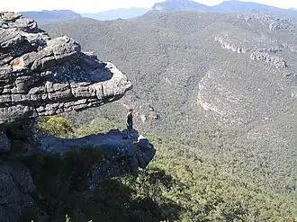 Left: View of the Balconies rock formation, formerly known as the Jaws of Death since it appears to be an open mouth of two rock slabs with a hiker standing inside