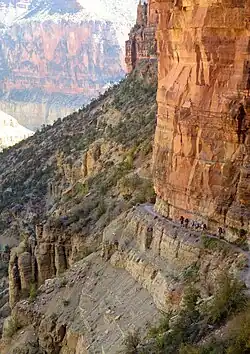 Muav Limestone cliff example, below Redwall Limestone cliff, on the North Kaibab Trail (closeup photos, often show purple erosion debris)(expandable photo)