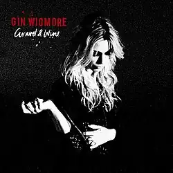 Black and white picture of Gin Wigmore, with a solid black background