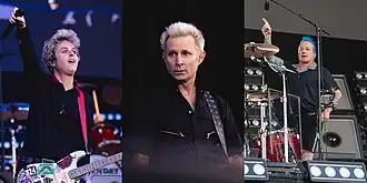 (L–R): Billie Joe Armstrong, Mike Dirnt, and Tré Cool performing in 2024 on their Saviors Tour