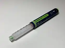 An uncapped injector pen labelled Insulatard
