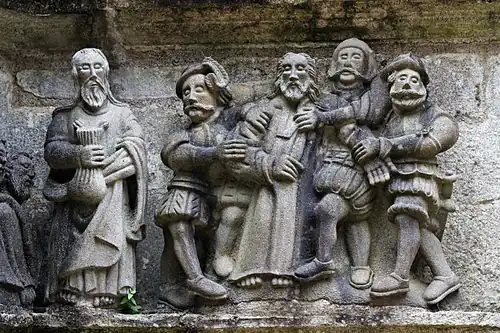 Jesus is arrested whilst Judas stands holding the purse.
