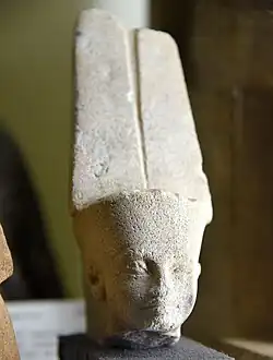 Head of the god Min-Amun wearing the double plume. Possibly reign of Tutankhamun, 14th century BCE. From Koptos (Qift), Egypt. Petrie Museum