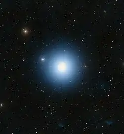 A large blue star in an ocean of other stars taken by telescope