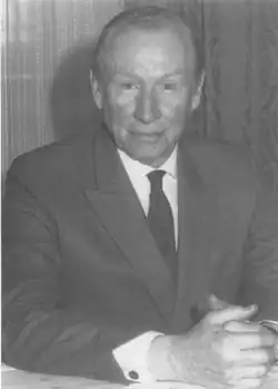 Black-and-white photography of a man in a suit