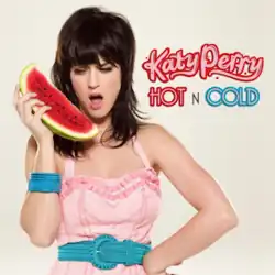 Perry holding a slice of watermelon near her face