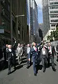 George W. Bush and John Howard walking along Phillip Street outside the Commonwealth Parliament Offices.