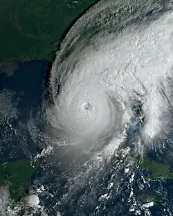 A satellite image that depicts Hurricane Ian, a category 5 hurricane, over southeastern portions of the Gulf of Mexico while approaching southwestern Florida on September 28, 2022. Timmer was stationed on Pine Island during the landfall of Hurricane Ian, which would occur several hours after the satellite image was taken.