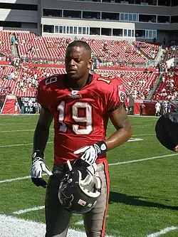 Ike hilliard wearing number 19 t-shirt in one of his matches