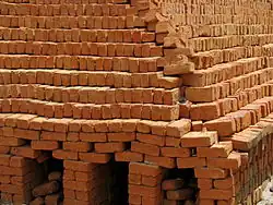 Dried bricks stacked ready for firing without the use of a kiln