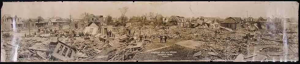 A panoramic photograph of tornado damage to multiple houses in a neighborhood in Indianapolis, Indiana, on May 18, 1927.