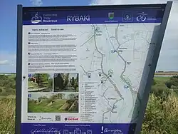 A tourist information board in the village