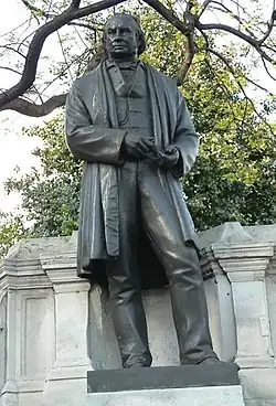 Bronze statue of Victorian man standing