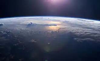 Image 72Sunset over the Pacific Ocean as seen from the International Space Station. Tops of thunderclouds are also visible. (from Pacific Ocean)