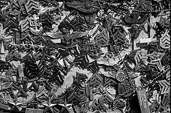 Insignia and other remembrances left by visitors on Mount Suribachi’s summit