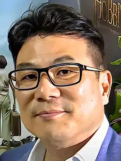 Jack Neo smiling at an event