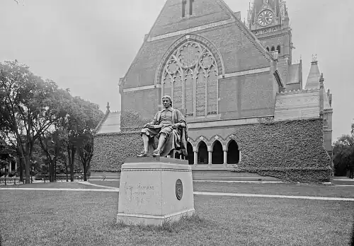 The John Harvard statue stood before Memorial Hall's west façade from 1884 to 1924, when it was moved to Harvard Yard.