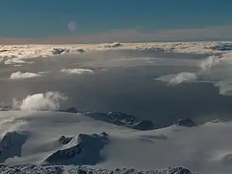 The Spanish base area from Mount Friesland, with Napier Peak and Johnsons Glacier in the foreground, Charrúa Ridge on the right and Mount Reina Sofia in the background, and South Bay, Hannah Point and western Livingston Island farther away