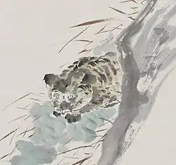 A tiger, composed of several blots of ink, crouching