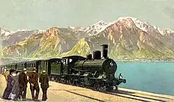 Train hauled by a B 3/4 on the shores of Lake Geneva with the Savoy Alps in the background.